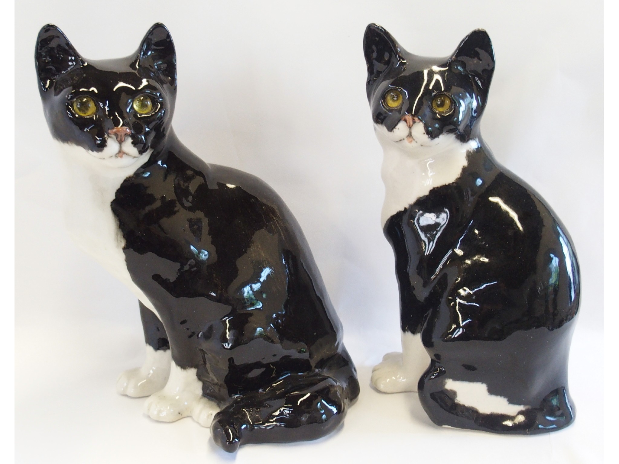 Appraisal: Pair of Winstanley English pottery figures of cats