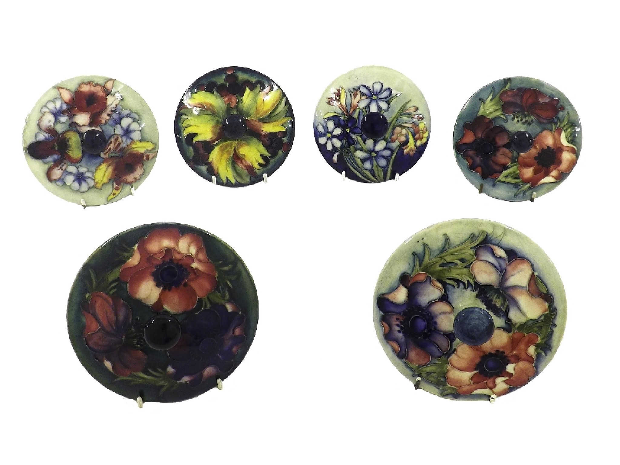 Appraisal: Six Moorcroft circular pot lids of various patterns diameter approx