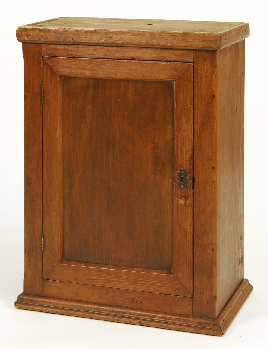 Appraisal: ANTIQUE HANGING WALL CABINET In pine with single paneled door