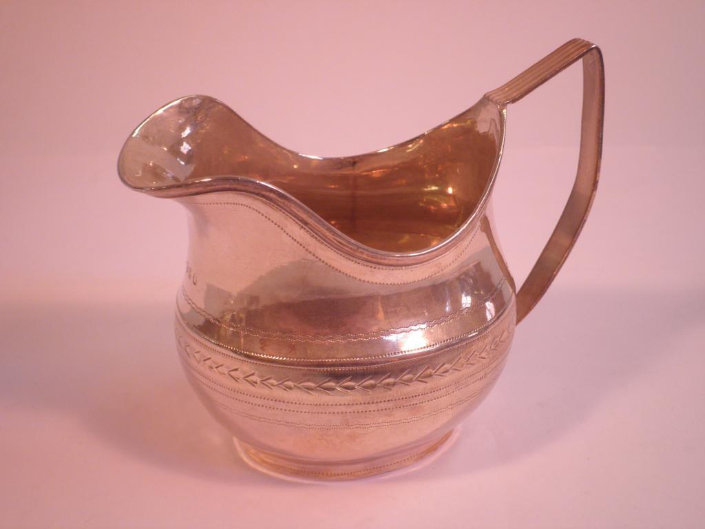 Appraisal: A William IV silver cream jug with bright cut decoration