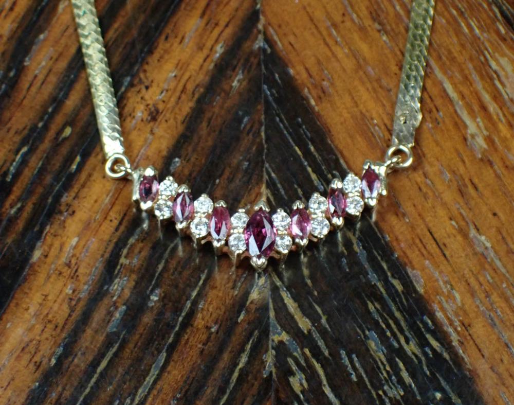 Appraisal: RUBY DIAMOND AND FOURTEEN KARAT GOLD NECKLACE with a length