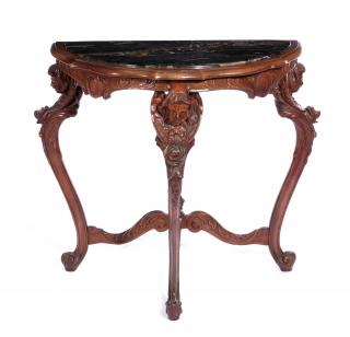 Appraisal: AN EARLY C ITALIAN WALNUT TABLE WITH CHERUBS The demilune