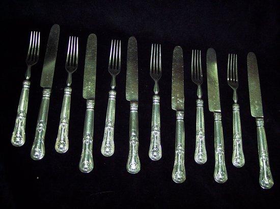 Appraisal: Six pairs of dessert knives and forks with filled silver