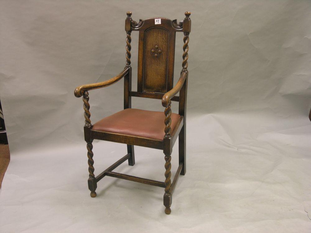 Appraisal: A pair of 's solid dark oak carver chairs with