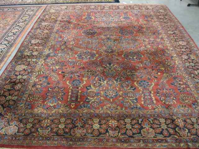 Appraisal: Sarouk Persian Handmade Room Size Rug elaborate floral burgundy field