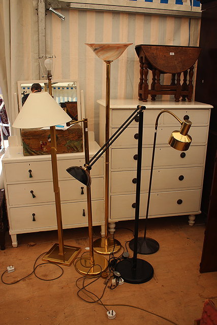 Appraisal: A CONTEMPORARY BRASS ADJUSTABLE STANDARD LAMP with circular base together