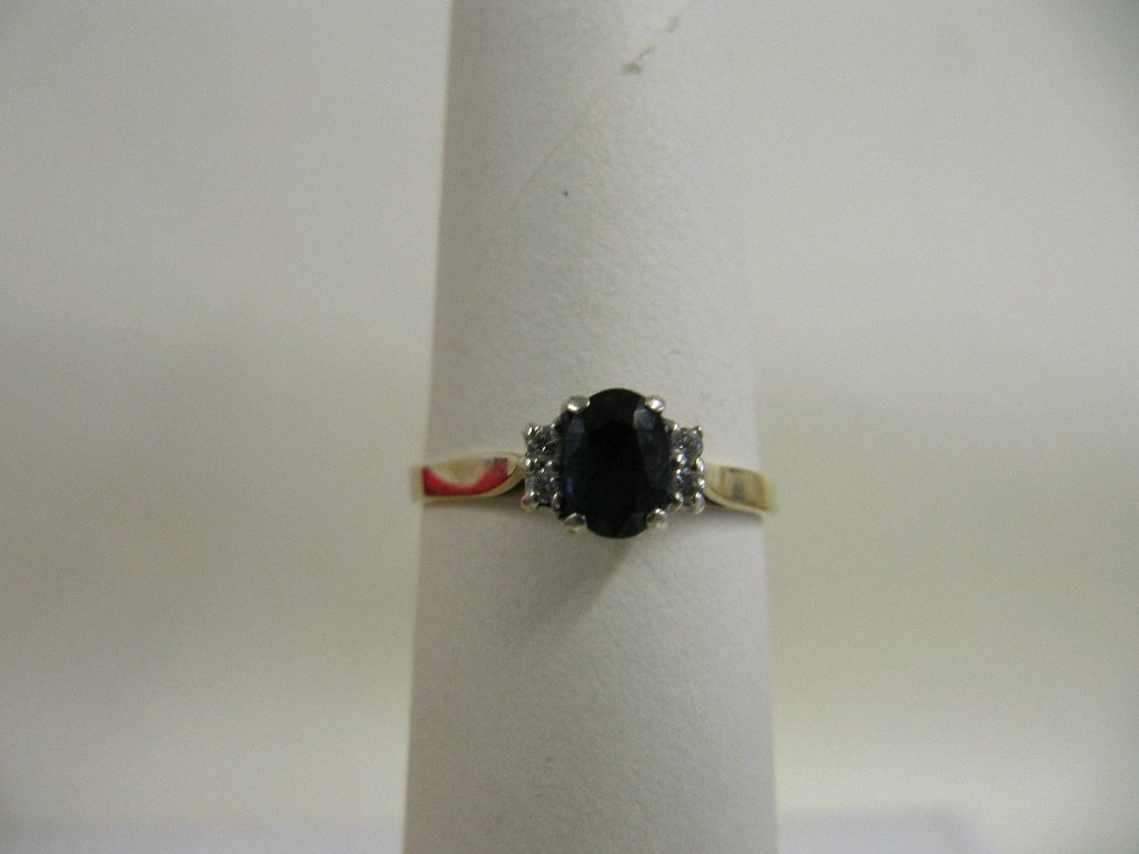 Appraisal: Nine carat gold sapphire and diamond set dress ring