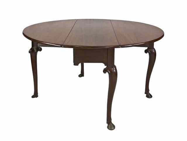 Appraisal: A George III mahogany oval two-flap table circa on cabriole