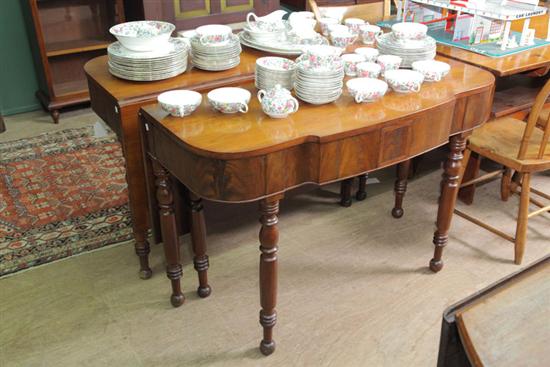 Appraisal: TWO PART BANQUET TABLE Mahogany and resting on turned legs