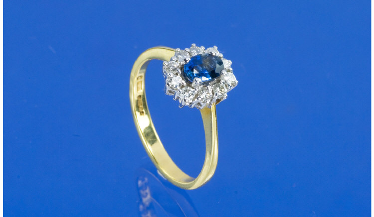 Appraisal: ct Gold Sapphire And Diamond Cluster Ring Central Oval Sapphire