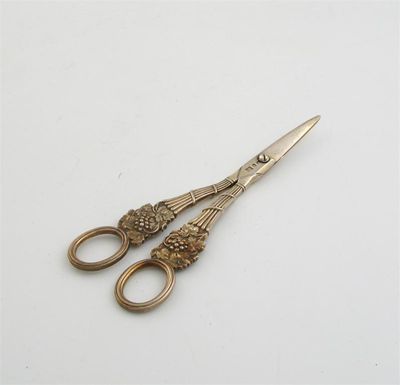 Appraisal: A pair of George III cast silvergilt grape scissors by