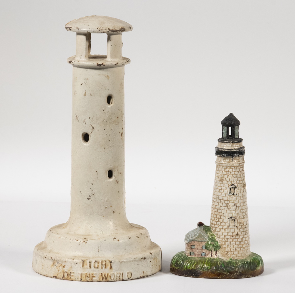 Appraisal: CAST IRON LIGHTHOUSE FORM STILL BANKS Including Vintage white painted