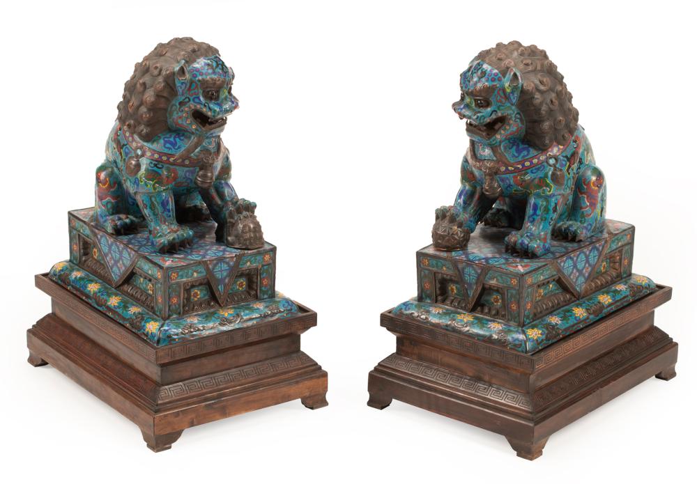 Appraisal: Pair of Chinese Cloisonne Enamel Buddhist Lions on Stands modeled