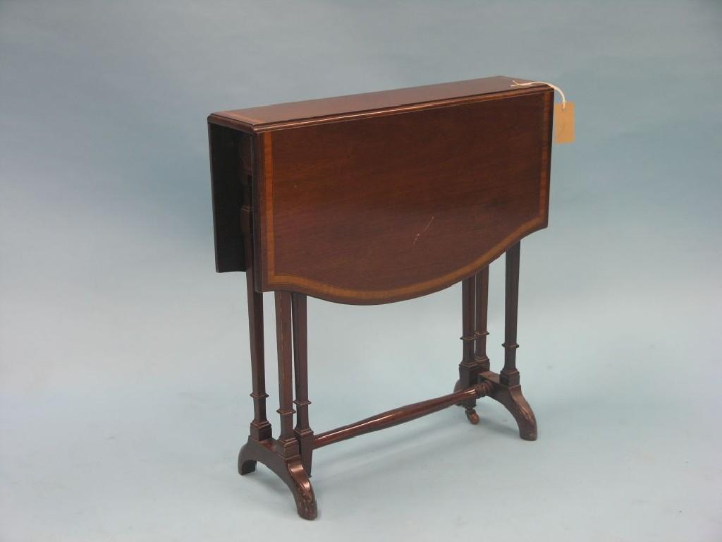 Appraisal: An Edwardian inlaid mahogany Sutherland table on slim square tapering