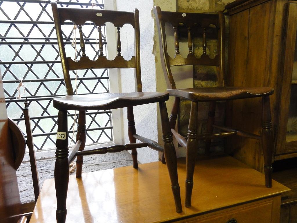 Appraisal: A pair of Victorian elm and beech wood kitchen chairs