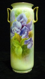 Appraisal: A Royal Doulton hand painted twin handled vase of shouldered