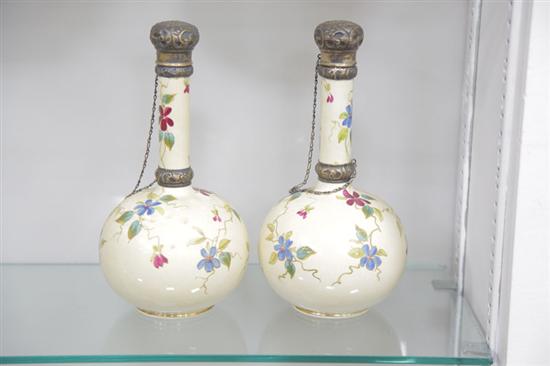 Appraisal: PAIR OF ENGLISH PORCELAIN DECANTERS Floral and gilt decorated decanters