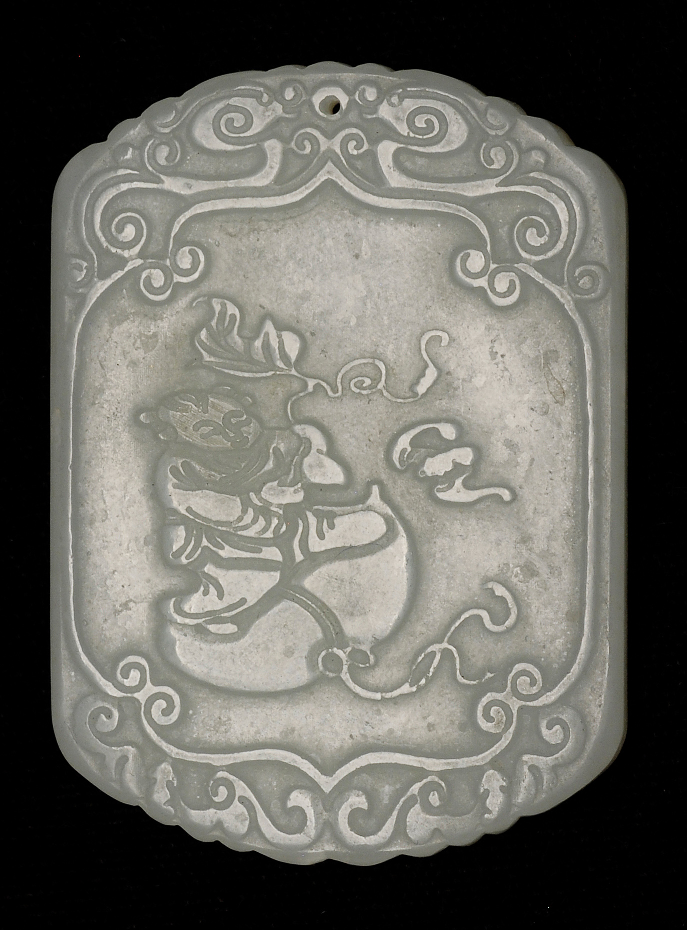 Appraisal: WHITE JADE PENDANT In modified rectangular form Carved on one