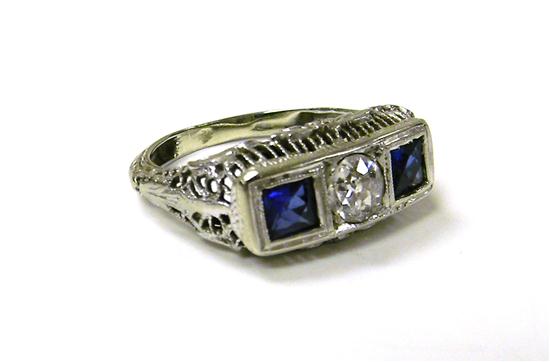 Appraisal: JEWELRY Diamond and sapphire filigree ring K white gold center