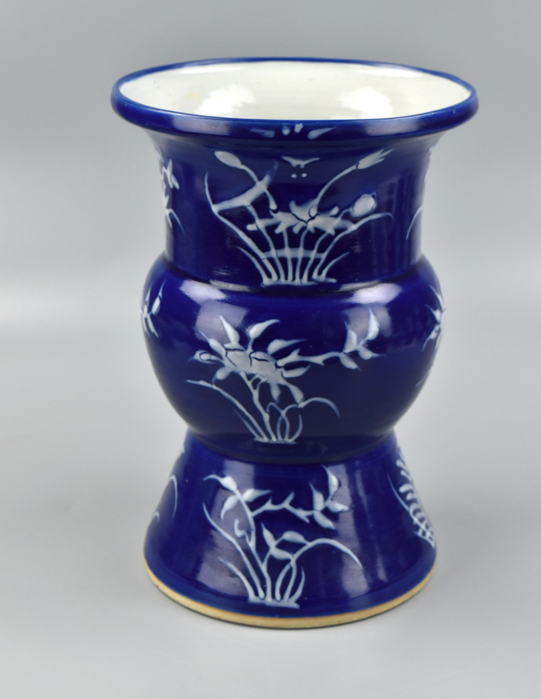 Appraisal: Chinese dark blue glazed spittoon th Century with vertical rows