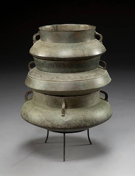 Appraisal: A set of three Asian bronze graduated vessels on stand