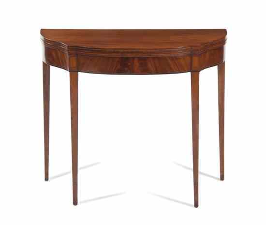 Appraisal: An American Mahogany Games Table having a shaped top over