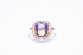 Appraisal: AN AMETRINE RING WITH DIAMONDS Featured ametrine has accent diamonds