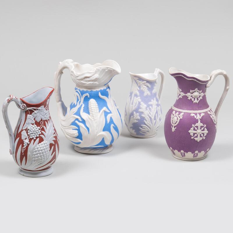 Appraisal: Group of Four English Porcelain Pitchers Comprising A coral molded