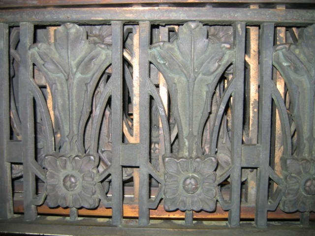 Appraisal: EIGHT PIECE CAST BRONZE SURROUND with Art Nouveau motif l