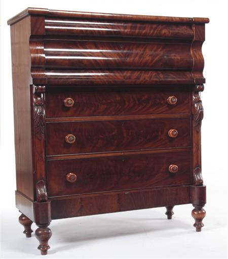 Appraisal: A flame mahogany Scotch chest the two concealed ogee frieze