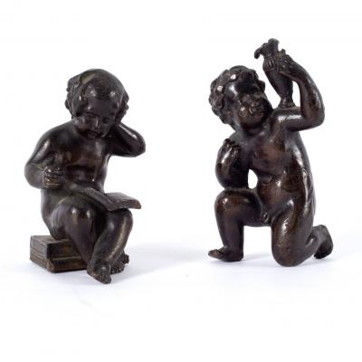 Appraisal: A pair of Victorian bronze putti one reading a book