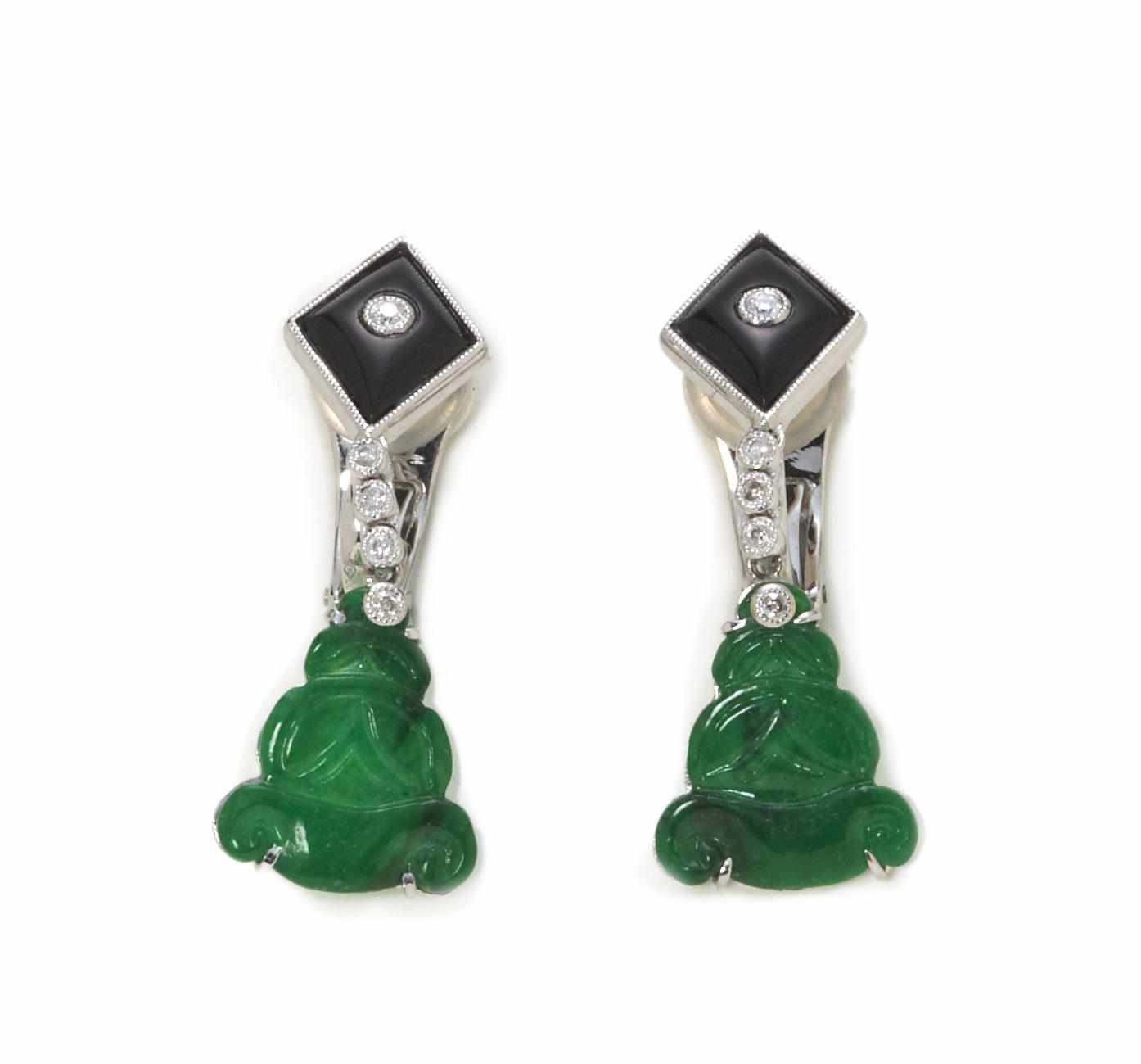 Appraisal: A pair of carved jade black onyx and diamond earrings