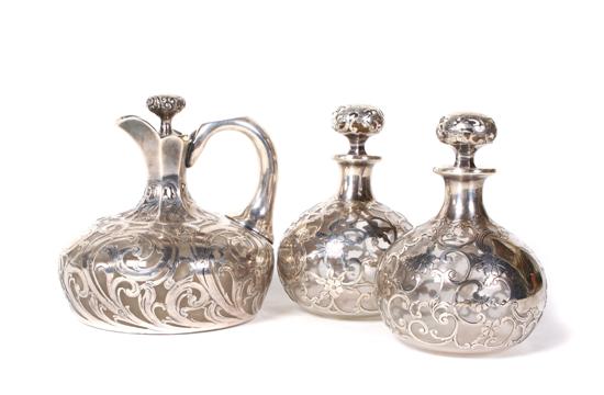 Appraisal: A Collection of Three American Silver Overlay Bottles Height of