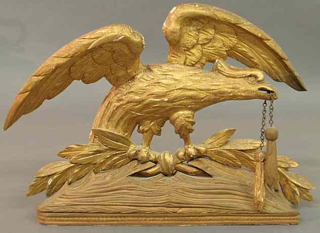 Appraisal: Gilt carved spread-winged eagle early th c the beak holding