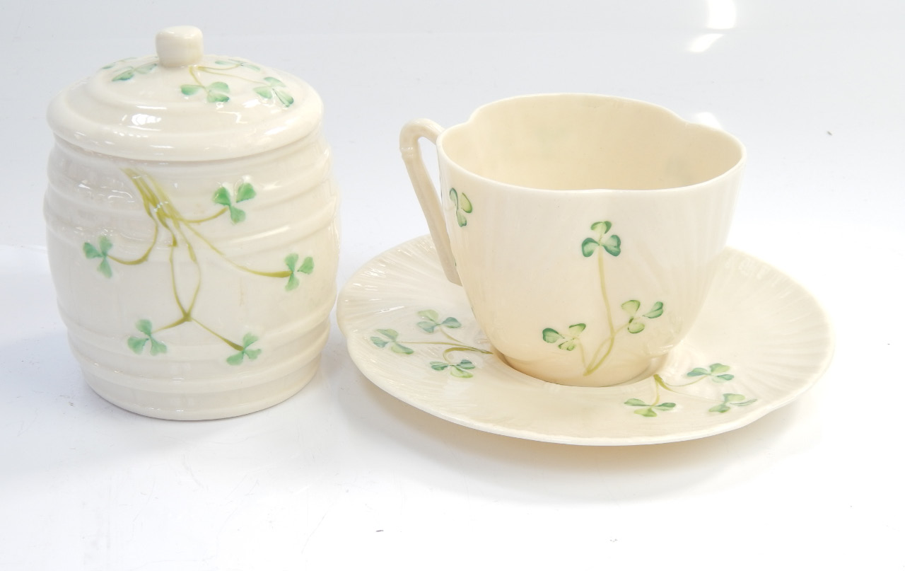 Appraisal: Three Belleek items comprising barrel jar and saucer and shamrock