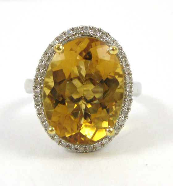 Appraisal: CITRINE DIAMOND AND FOURTEEN KARAT GOLD RING The white gold