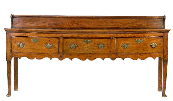 Appraisal: A George III oak and elm low dresser height in