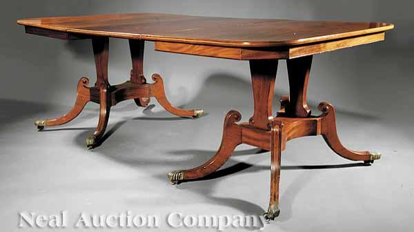 Appraisal: An Antique Regency-Style Inlaid Mahogany Pedestal Dining Table the rectangular