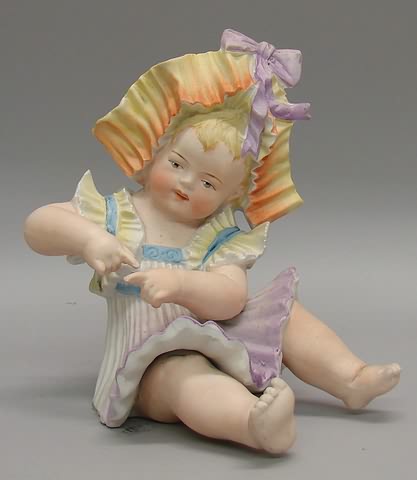 Appraisal: Bisque figurine of sitting child with fancy molded pleated bonnet