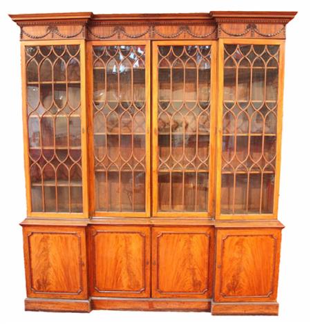 Appraisal: A George III mahogany inverted breakfront library bookcase adapted from