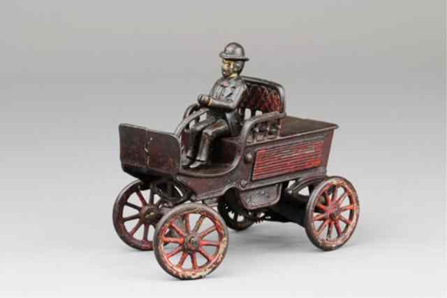 Appraisal: WILKENS EARLY TILLER STEERING CAR WITH DRIVER Clockwork example one