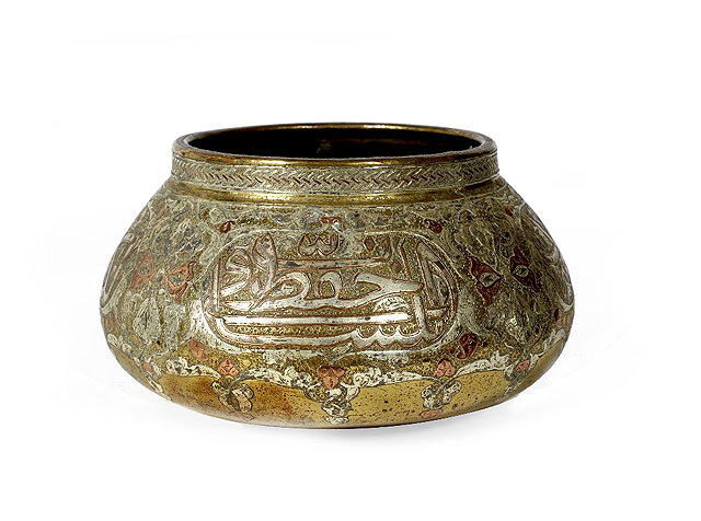 Appraisal: A Mamluk brass and inlaid bowlcirca with Islamic script inlaid