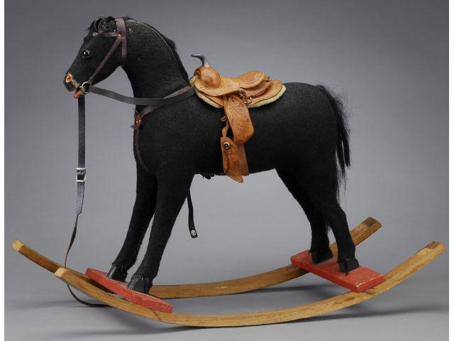 Appraisal: Rocking Horse America ca Cloth covered wood horse with glass