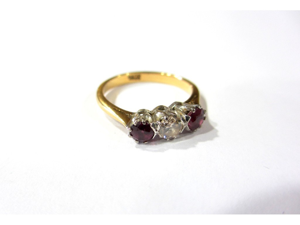 Appraisal: A ruby and diamond three stone ring the centre brilliant