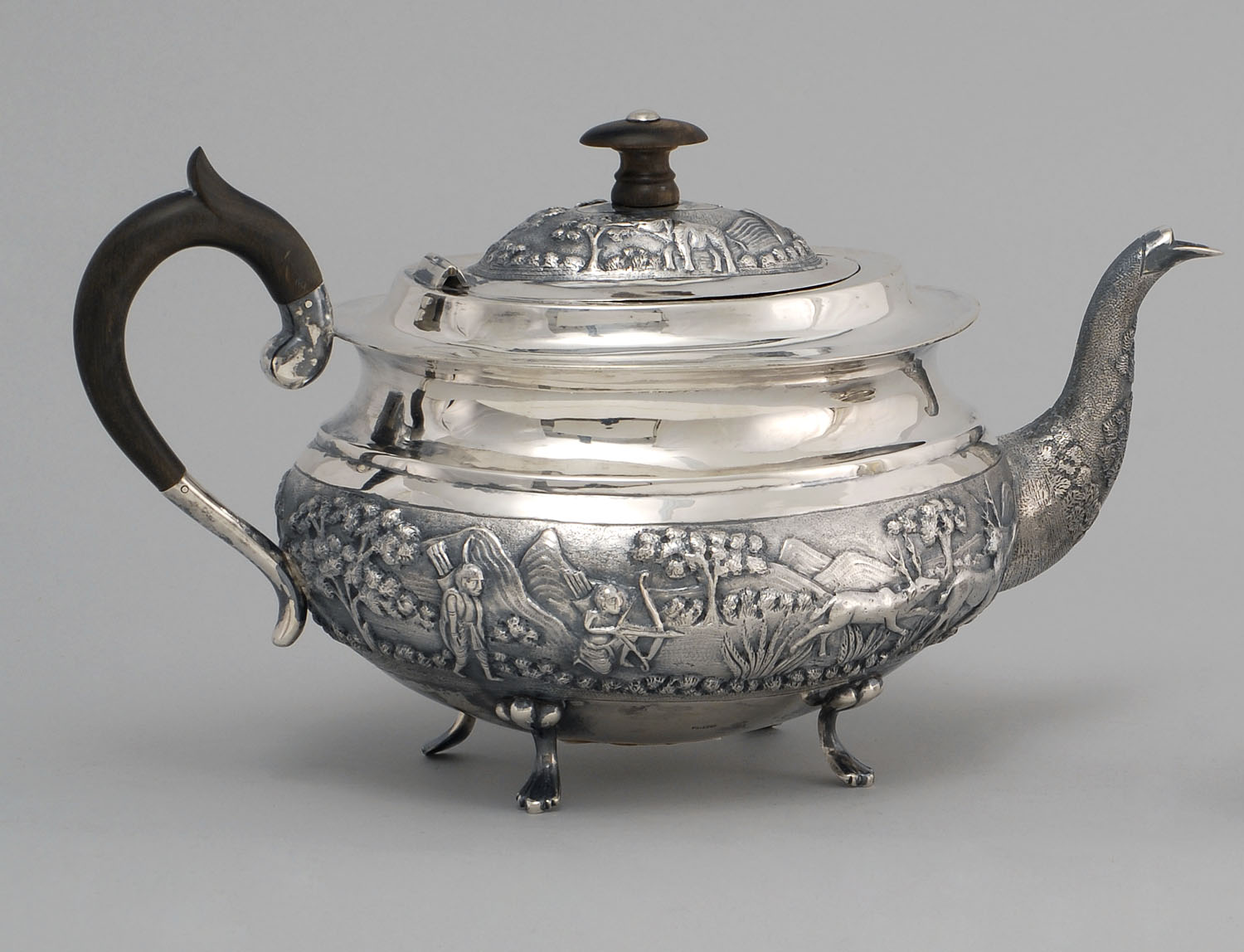 Appraisal: CONTINENTAL SILVER COFFEEPOT With raised chased design of a safari