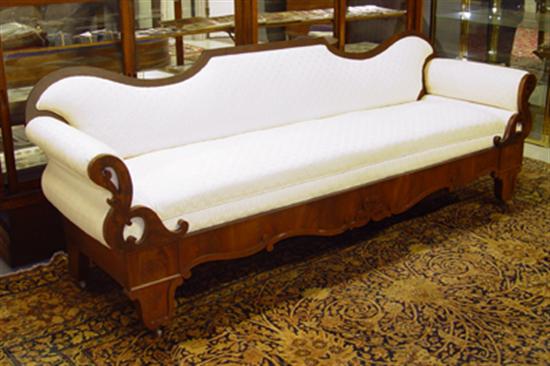 Appraisal: Country Empire Walnut Sofa Mid th Century Serpentine back and