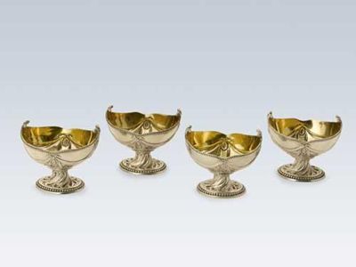 Appraisal: A set of four George III neoclassical salts with wrythen