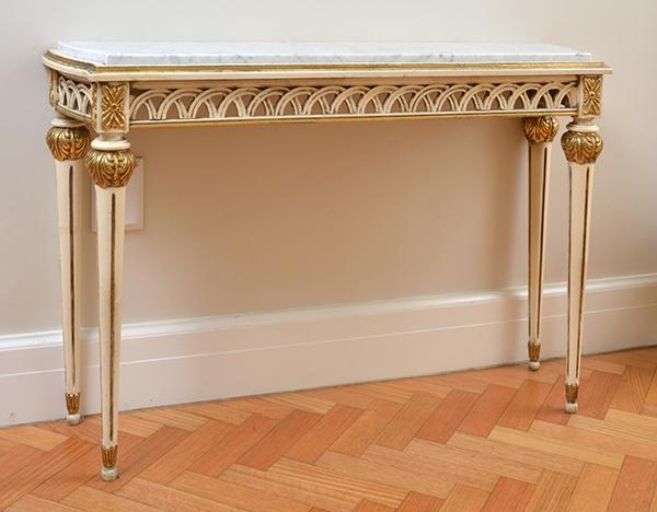 Appraisal: A PAINTED AND GILT WOOD MARBLE TOP CONSOLE WITH FLUTED