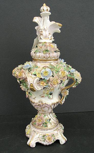 Appraisal: A Dresden style porcelain floral encrusted covered urn on stand