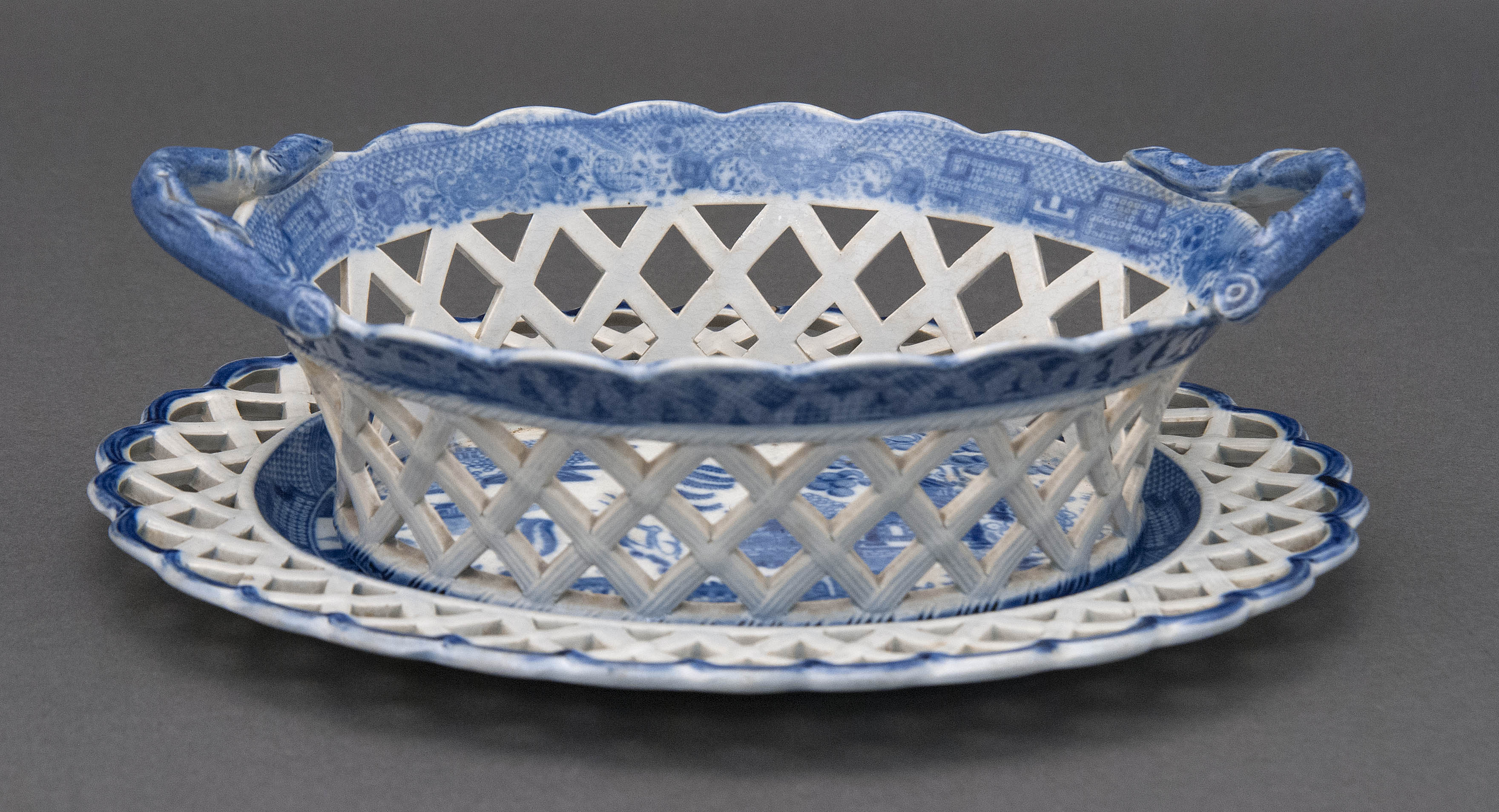 Appraisal: BLUE AND WHITE TRANSFERWARE CHESTNUT BASKET AND UNDERTRAY English Early